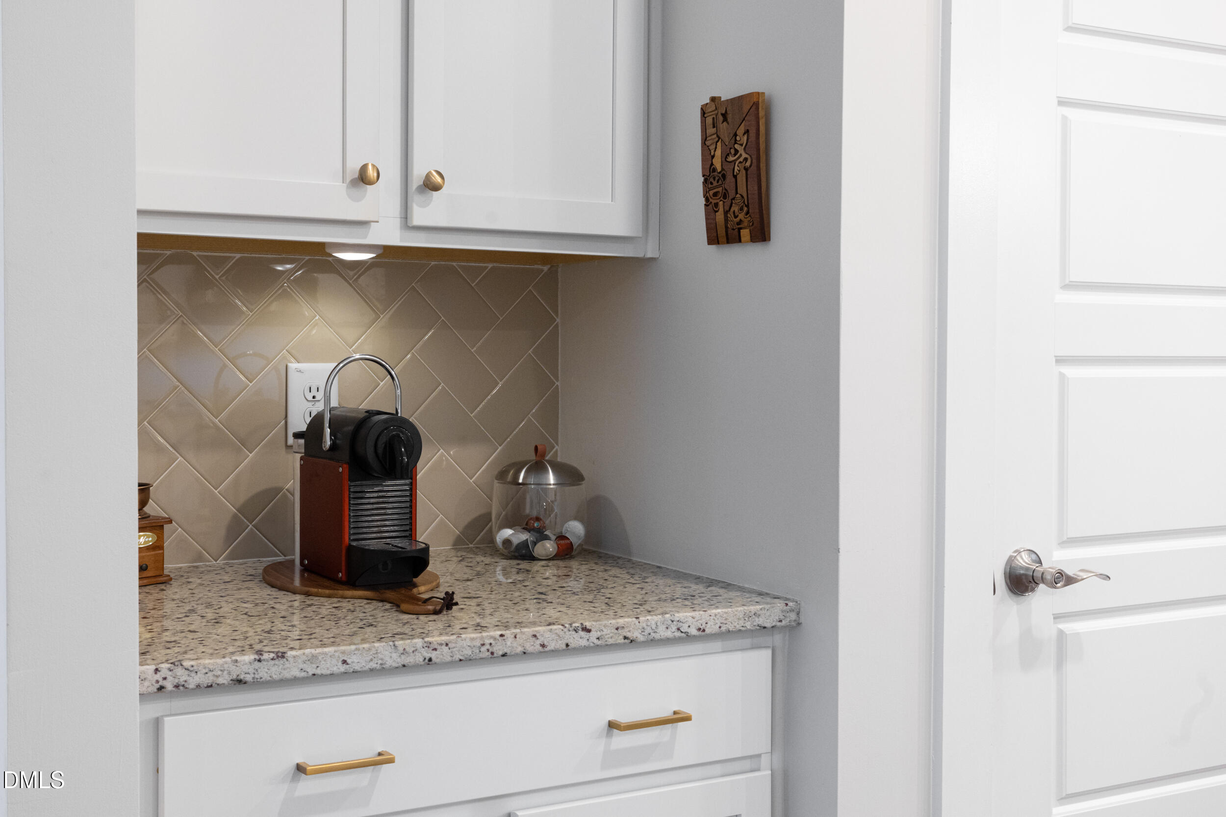 469 Rally Point Place Wake Forest, NC 27587 - Photo 8 of 37 a kitchen with a granite countertop sink and cabinets