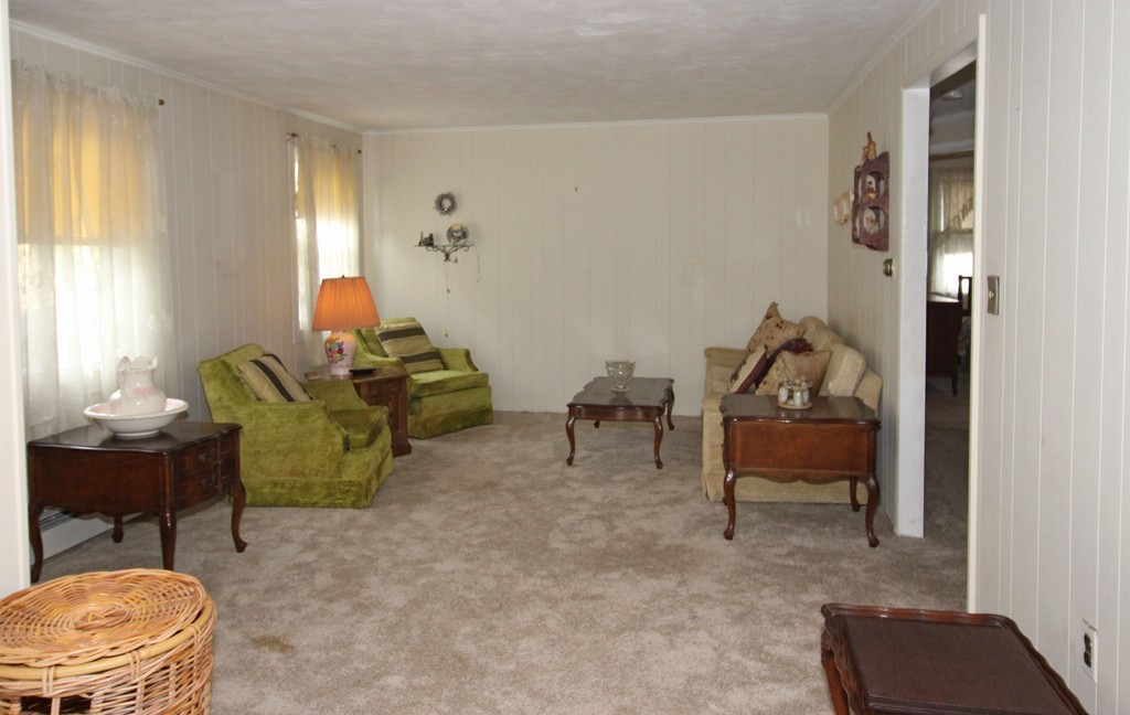 430 Newport Road Hull, MA 02045 - Photo 5 of 10 a living room with furniture and a chair