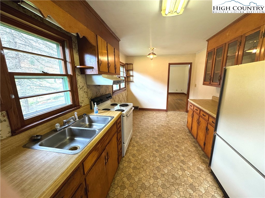 2510 Rich Hill Road Creston, NC 28615 - Photo 10 of 38 a kitchen with sink a stove and refrigerator