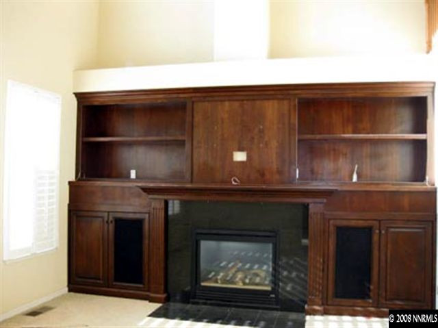 4542 Goodwin Road Sparks, NV 89436 - Photo 6 of 9 a fireplace