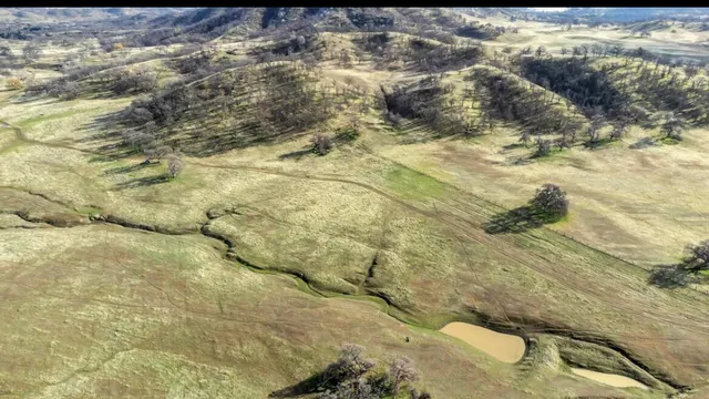 a view of a dry space with mountain view