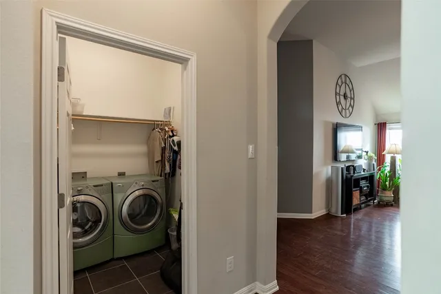 a view of a hallway with closet and couch