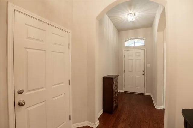 a view of livingroom and dining room with wooden floor