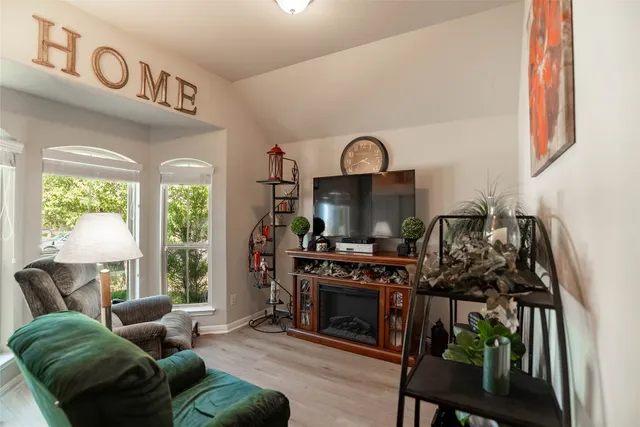 a living room with furniture and a rug