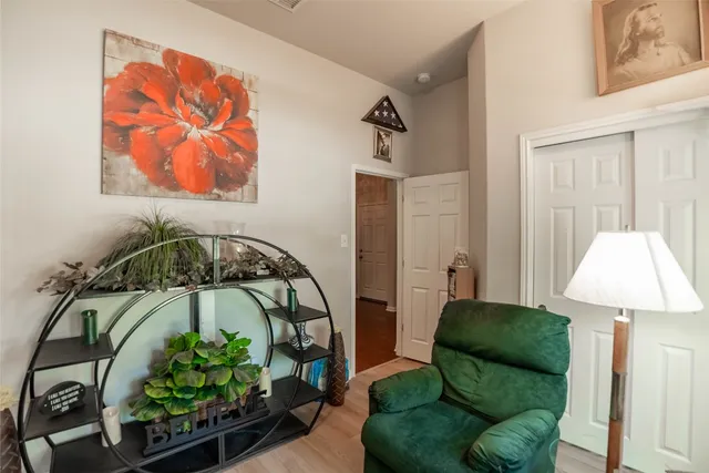 a bedroom with furniture and a window