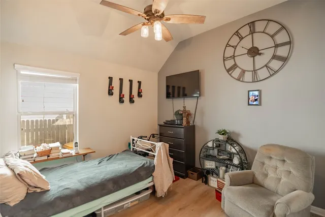 a view of a patio with table and chairs and potted plants