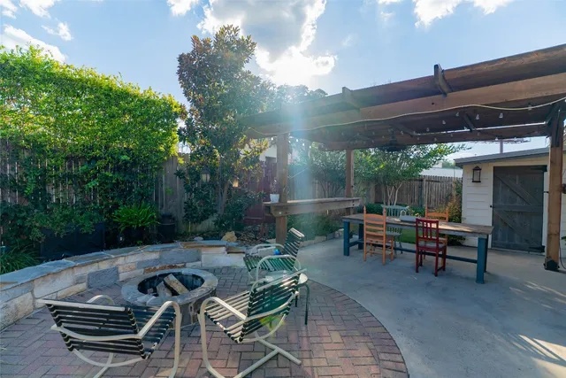 a view of a backyard with sitting area and furniture