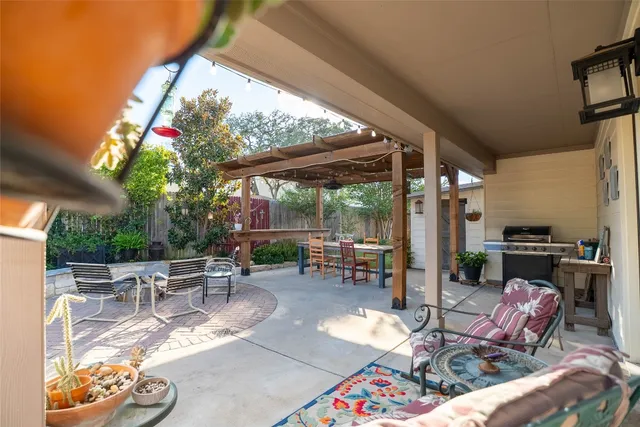 a view of yard with patio