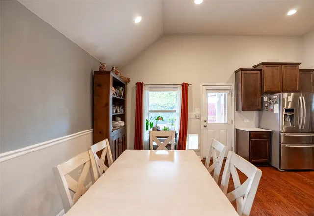 a bedroom with a bed and a television