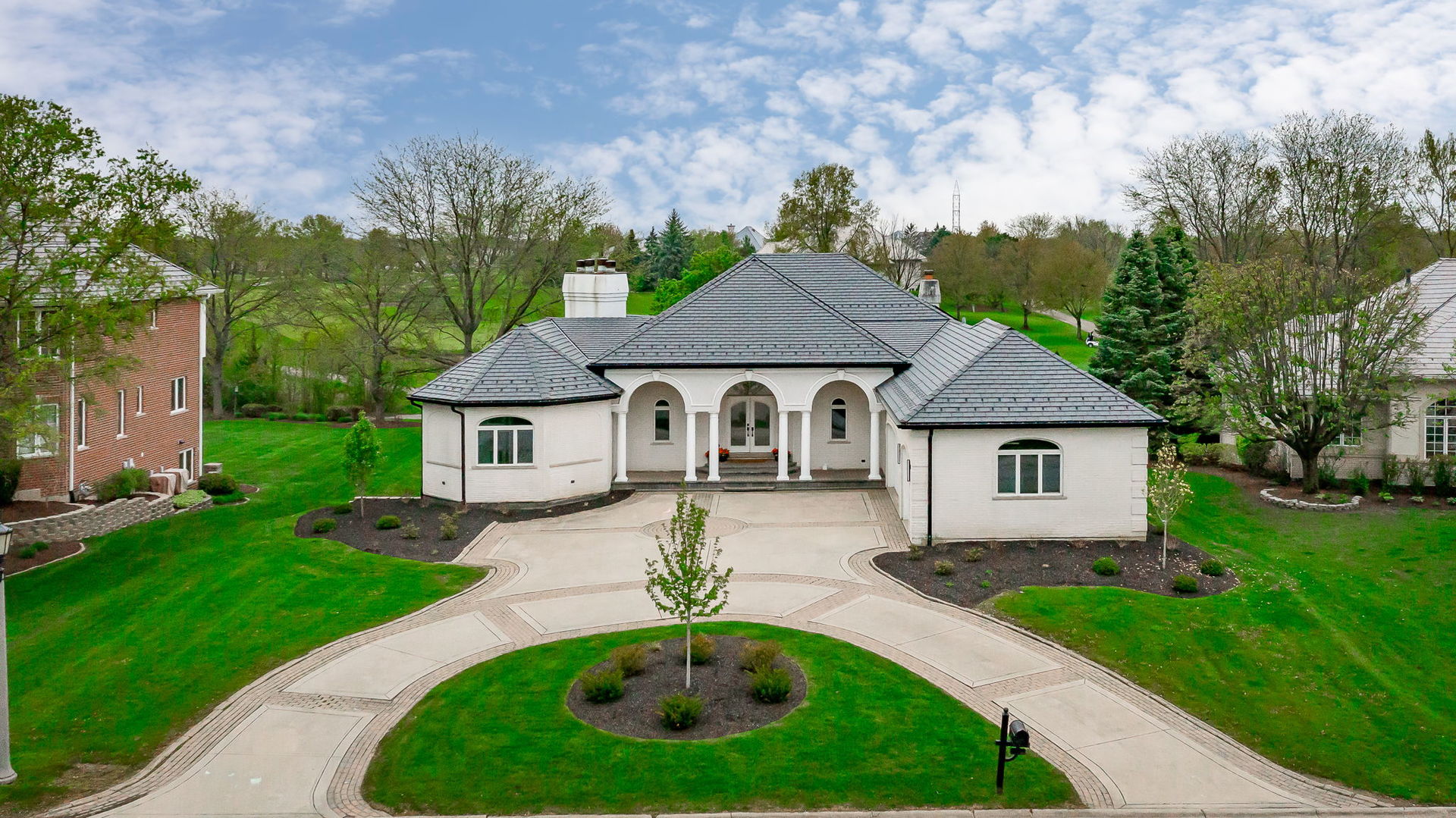 a front view of a house with garden