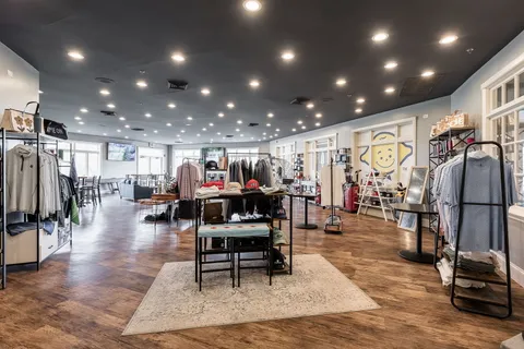 a view of a room with lots of gym equipment