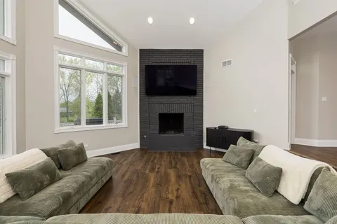 a living room with furniture and a fireplace