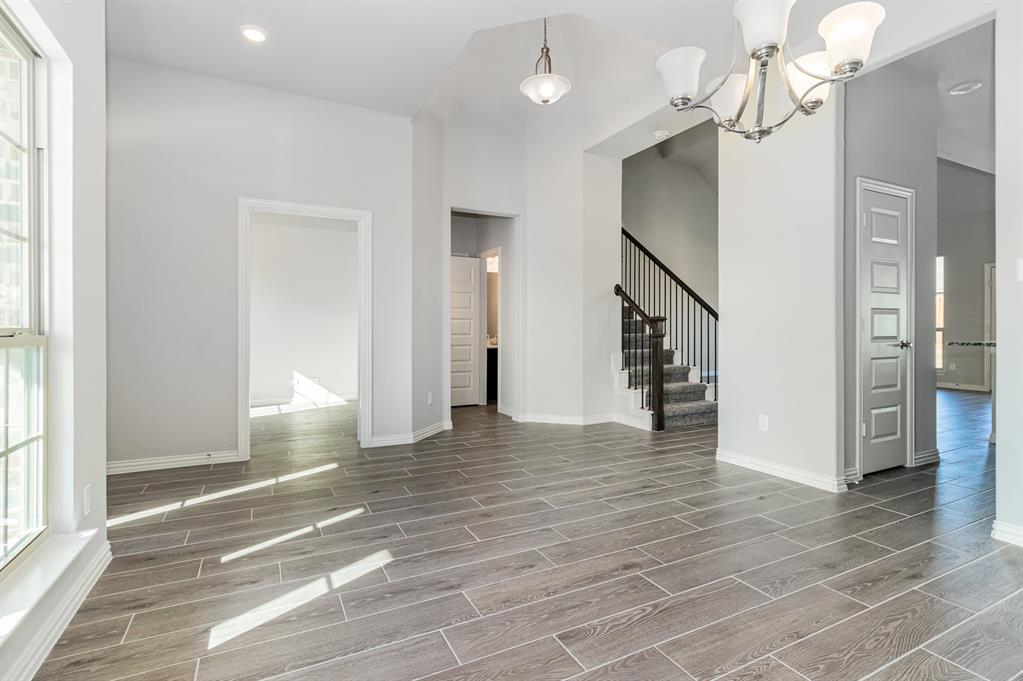 232 Cisco Trail Forney, TX 75126 - Photo 20 of 27 a view of empty room with wooden floor and fan