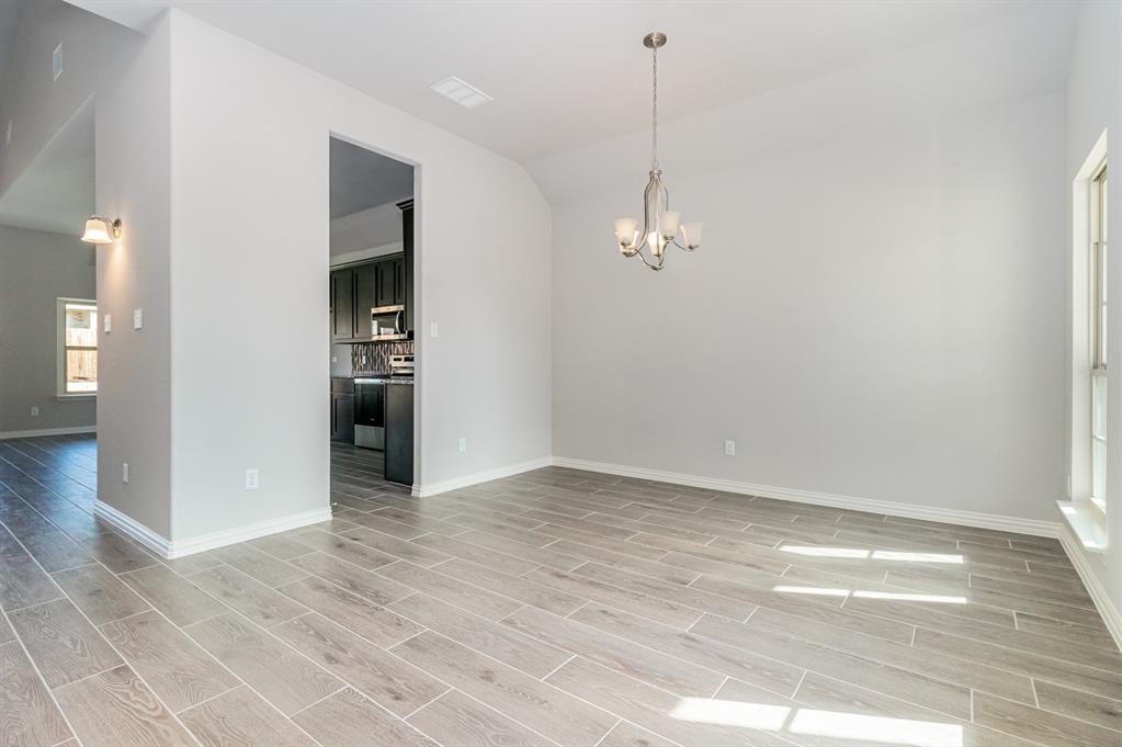 232 Cisco Trail Forney, TX 75126 - Photo 21 of 27 a view of empty room with wooden floor