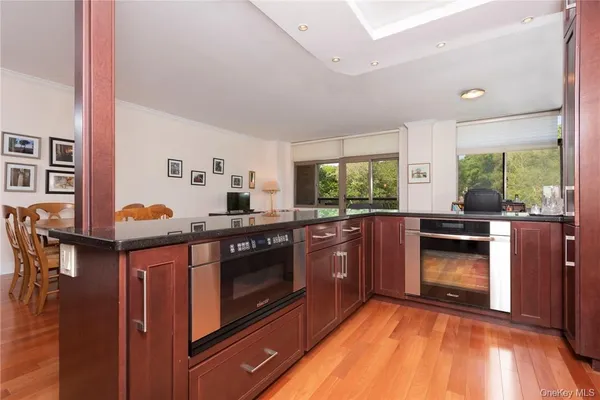 a kitchen with stainless steel appliances granite countertop a stove and a sink