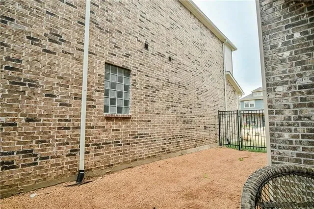 a view of a chair and table in the patio