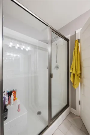 a bathroom with a shower and a sink