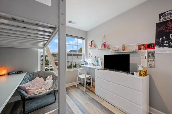 a room with furniture and a flat screen tv