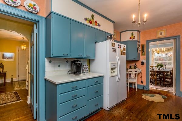 1103 Harvey Street Raleigh, NC 27608 - Photo 12 of 25 a kitchen with a refrigerator and a sink