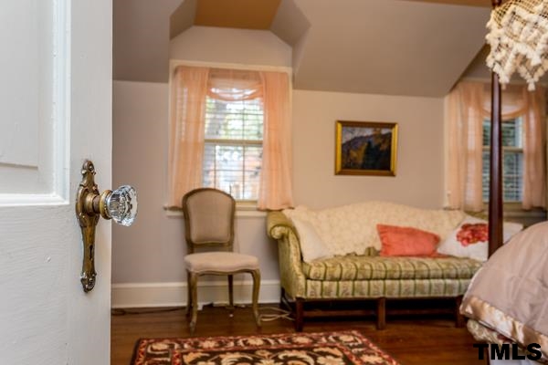 1103 Harvey Street Raleigh, NC 27608 - Photo 16 of 25 a bedroom with furniture and a window