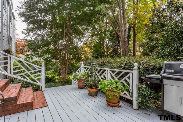 1103 Harvey Street Raleigh, NC 27608 - Photo 20 of 25 a view of a balcony with chairs and wooden floor