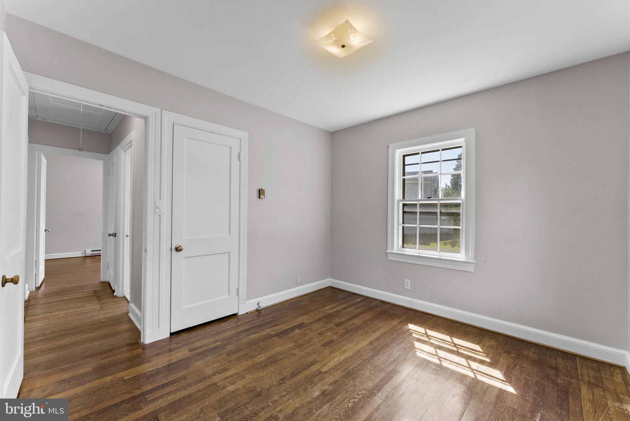 539 Old Meetze Road Warrenton, VA 20186 - Photo 18 of 30 an empty room with wooden floor and windows