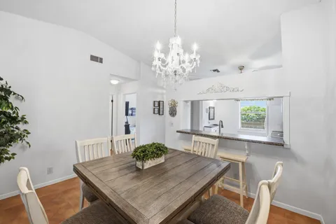 a view of a dining room with furniture and window