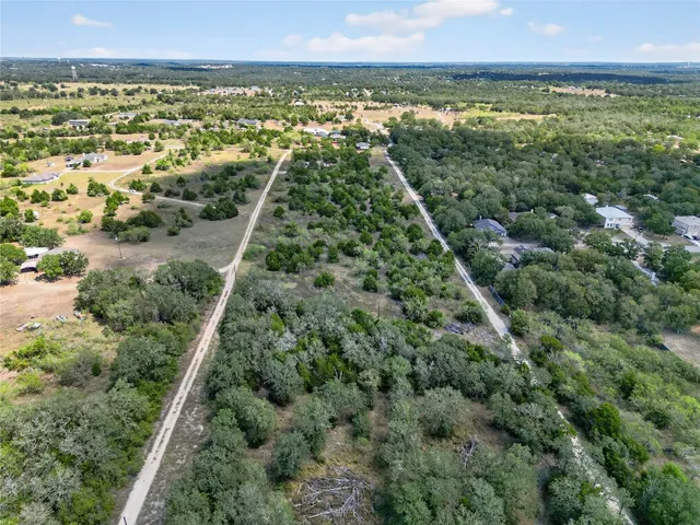 an aerial view of residential building and lake
