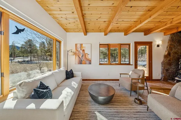 a reading room with furniture and a window
