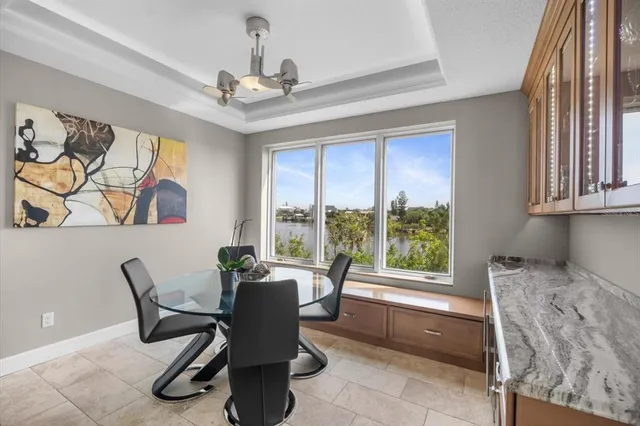 a living room with furniture a flat screen tv and a table
