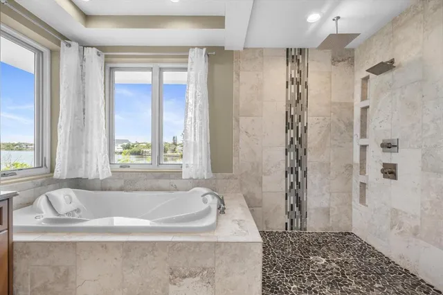 a living room with furniture a clock on wall and a window