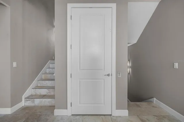 a view of a house with swimming pool and porch