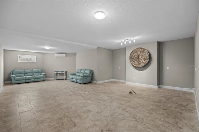 a view of a livingroom with furniture and outdoor kitchen