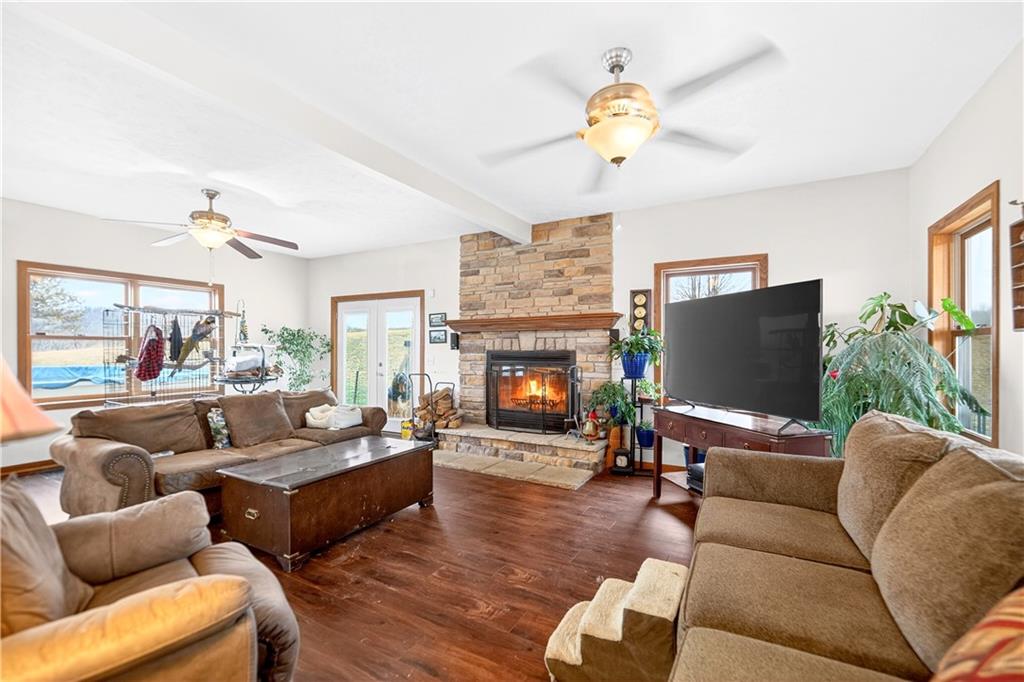 220 Main Road West Alexander, PA 15376 - Photo 14 of 44 a living room with furniture a fireplace and a flat screen tv
