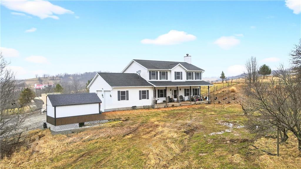 220 Main Road West Alexander, PA 15376 - Photo 2 of 44 a front view of a house with a garden
