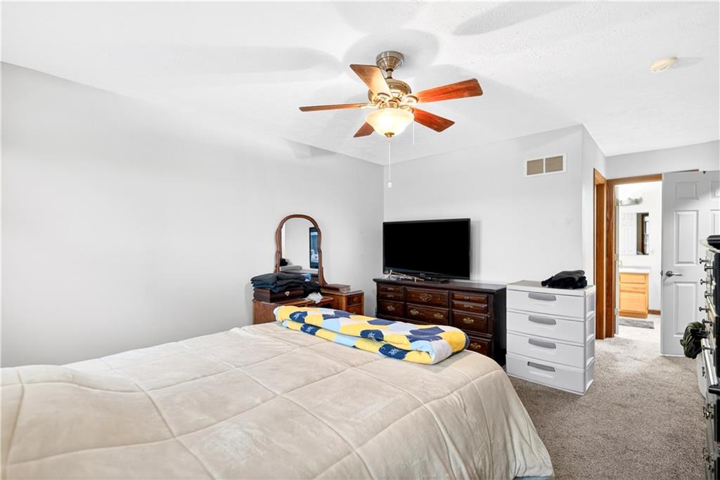 220 Main Road West Alexander, PA 15376 - Photo 26 of 44 a bedroom with a bed and a flat screen tv