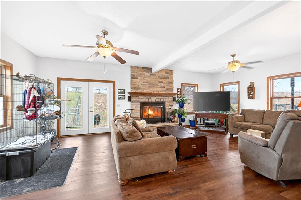 220 Main Road West Alexander, PA 15376 - Photo 10 of 44 a living room with furniture a flat screen tv and a fireplace