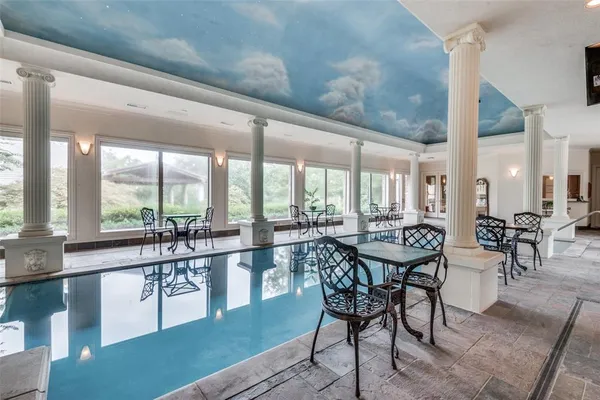 a spacious bedroom with a large bed and a large window