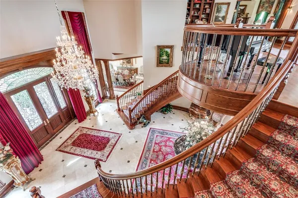 a lobby with furniture and a rug