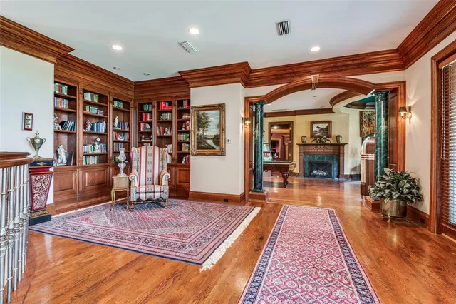a living room with furniture a table and chairs