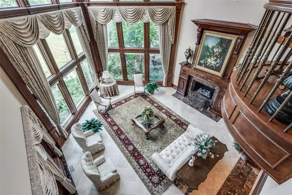 a spacious bedroom with a large bed and a large mirror