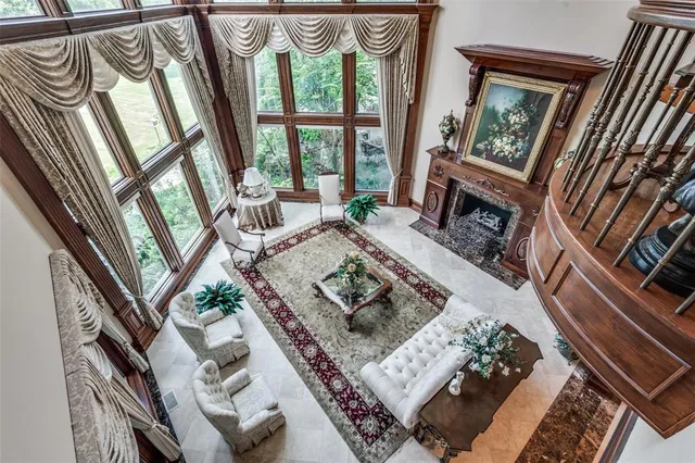 a spacious bedroom with a large bed and a large mirror