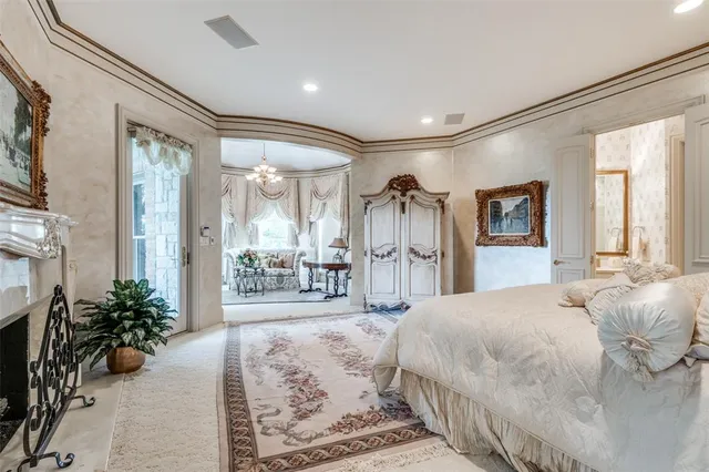 a view of a chair and table in the patio in front of a house