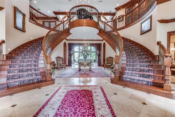 a reading room with furniture and a rug
