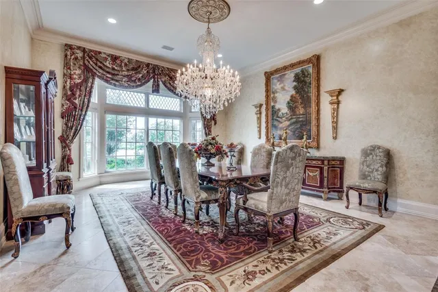 a living room with furniture large window and a fireplace