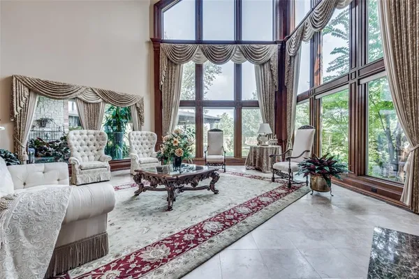 a living room with furniture chandelier and living room view