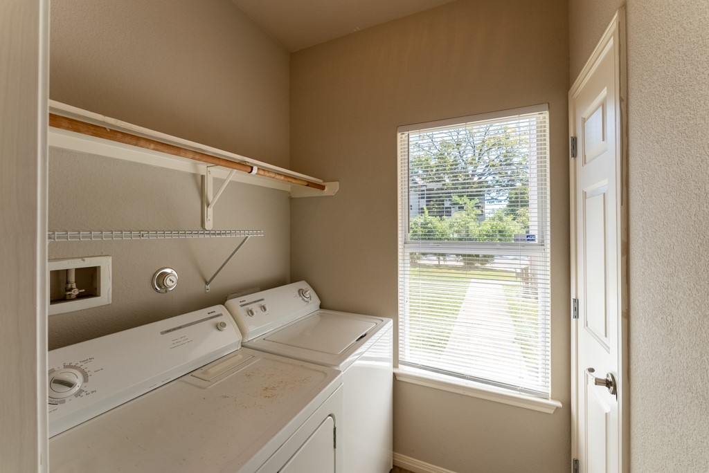 3000 Govalle Avenue, Unit B Austin, TX 78702 - Photo 12 of 26 Laundry room featuring washer and clothes dryer