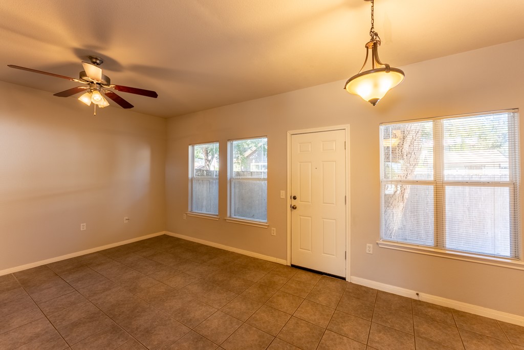 3000 Govalle Avenue, Unit B Austin, TX 78702 - Photo 13 of 26 Tiled entryway with baseboards and a ceiling fan
