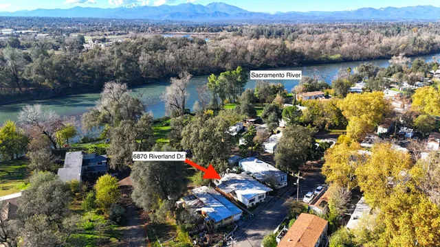 an aerial view of a house with a lake view
