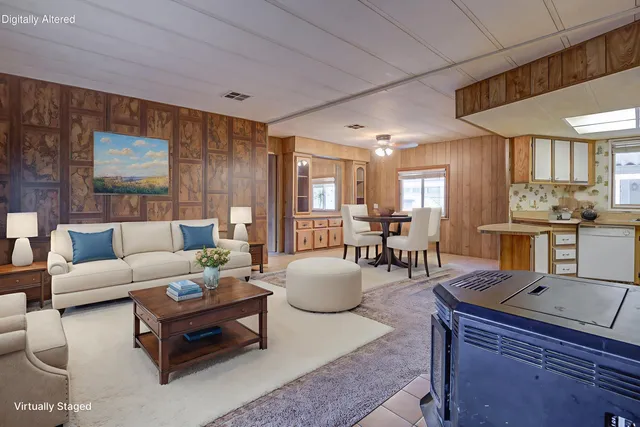 a living room with furniture and a table
